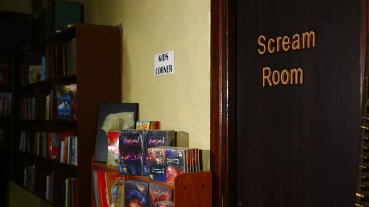 The scream room can be found right next to the smaller shelves by the children corner.