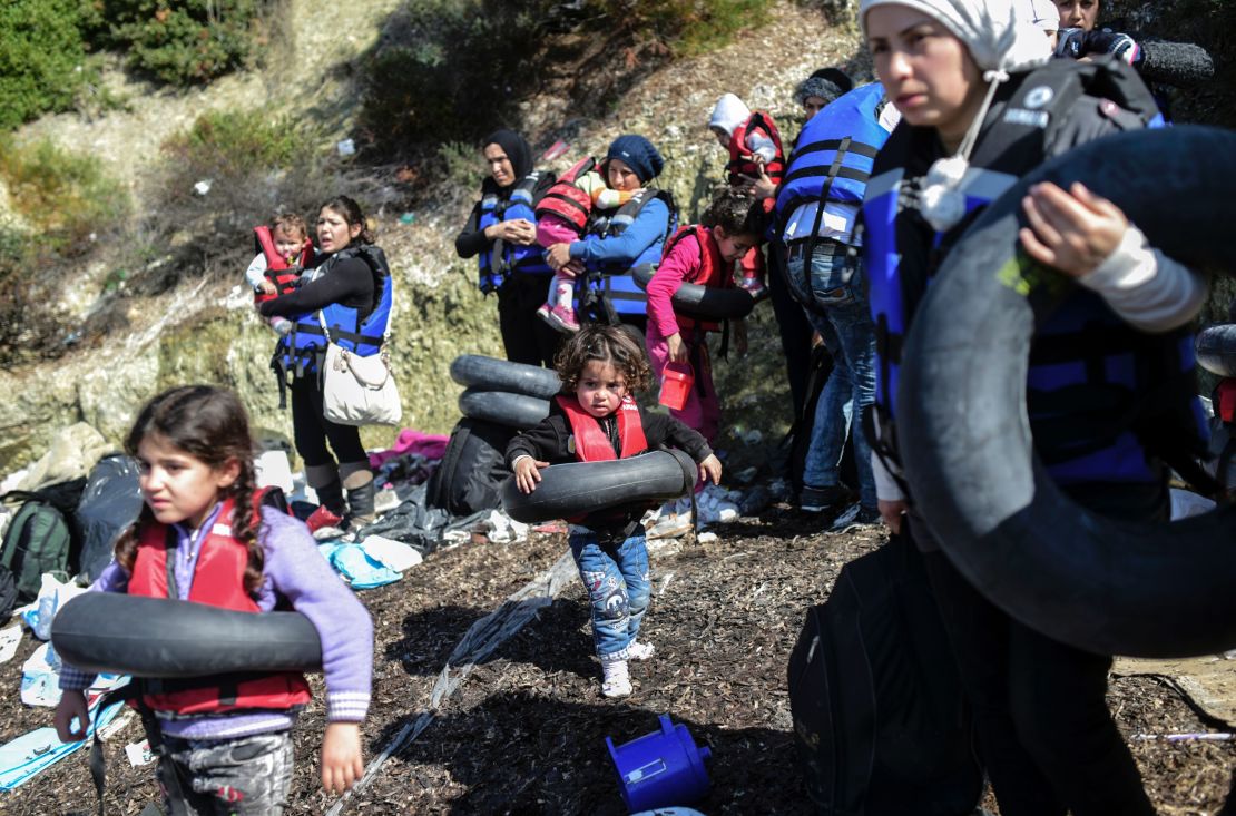 War behind them, the sea ahead of them: Syrians prepare to board a dinghy to cross the Aegean Sea for Lesbos in February.