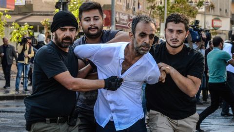 Turkish officers detain a protester after the arrest of two Kurdish leaders in Diyarbakir.