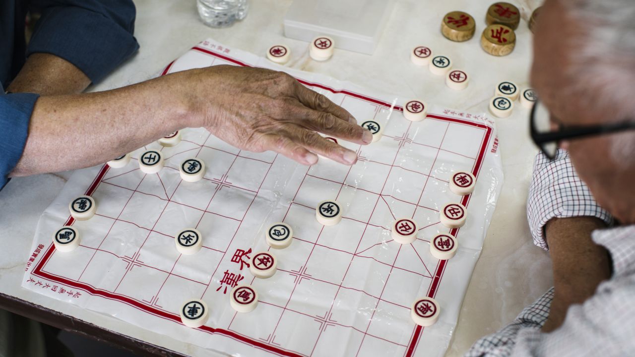 Men play xiangqi in the food court of Hong Kong City Mall in Houston. The city's Chinatown is 12 miles southwest of downtown.