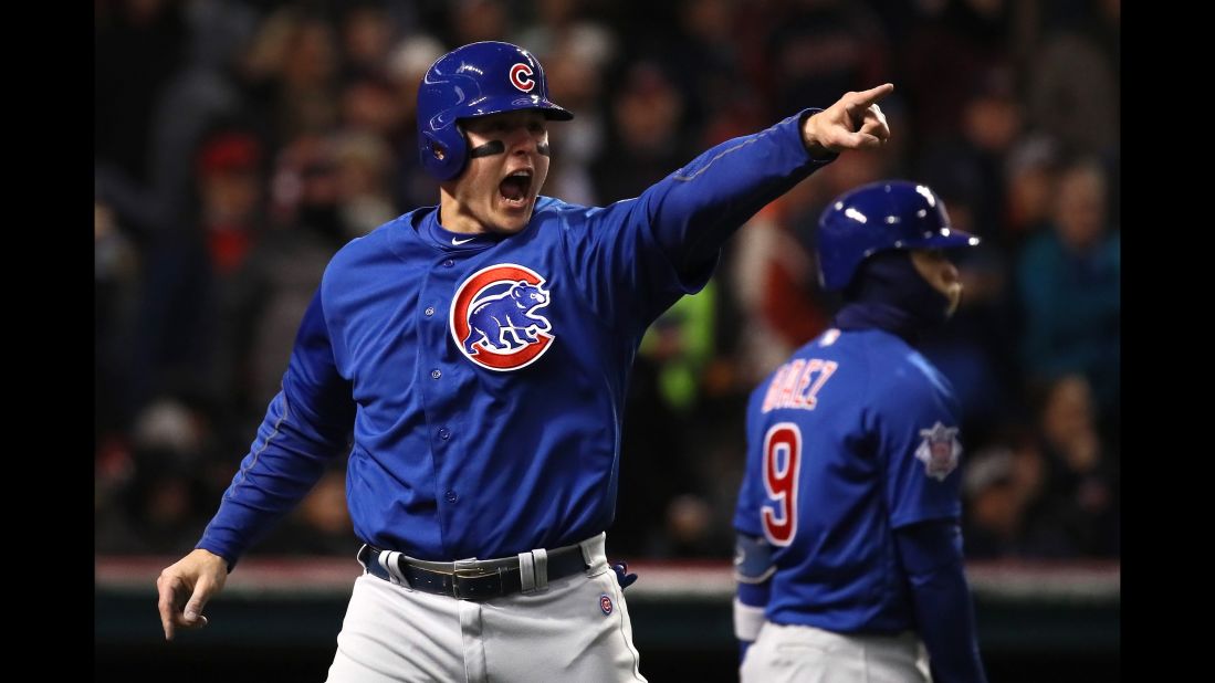 Anthony Rizzo of the Cubs celebrates scoring a run on an RBI single hit by Kyle Schwarber (not pictured) during the third inning in Game 2.