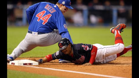 Francisco Lindor of the Indians dives back to first on an attempted pick-off in Game 2.