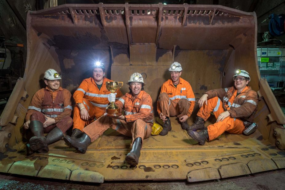 Brian Connelly, Mick Williams, Nigel Shinnick, Angelo Dal Carrobbo and James Hooper pose with the trophy at BHP Billiton's Olympic Dam copper, gold and uranium mine in Roxby Downs, South Australia. 