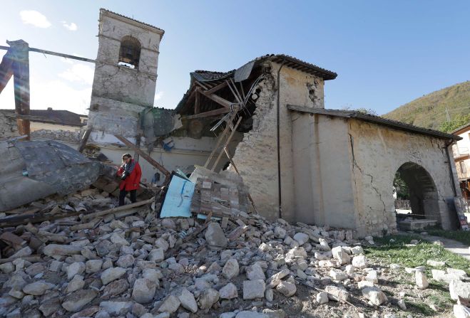 A woman walks among debris at the Church of St. Antony, dating from the 14th century, in the town of Visso on Thursday, October 27, after a pair of earthquakes rocked central Italy. A magnitude 5.5 quake struck Wednesday, October 26, followed hours later by a magnitude 6.1 temblor. No deaths were reported, but historic buildings were damaged in the region where a powerful <a href="index.php?page=&url=http%3A%2F%2Fwww.cnn.com%2F2016%2F08%2F27%2Feurope%2Fitaly-earthquake-amatrice-perugia%2F">quake killed nearly 300 people</a> in August. 