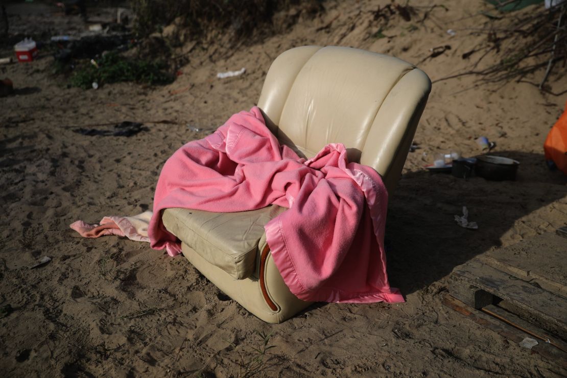 A leather armchair -- too big to carry -- with a blanket.