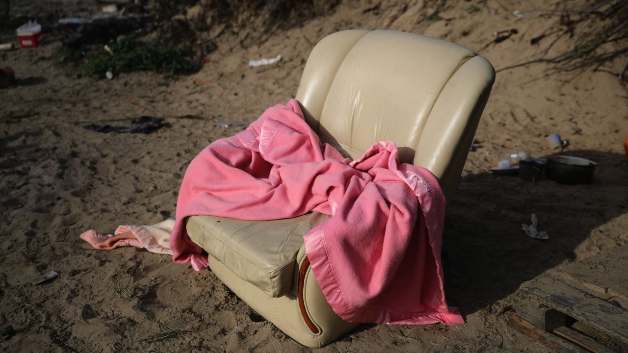 A leather armchair -- too big to carry -- with a blanket.