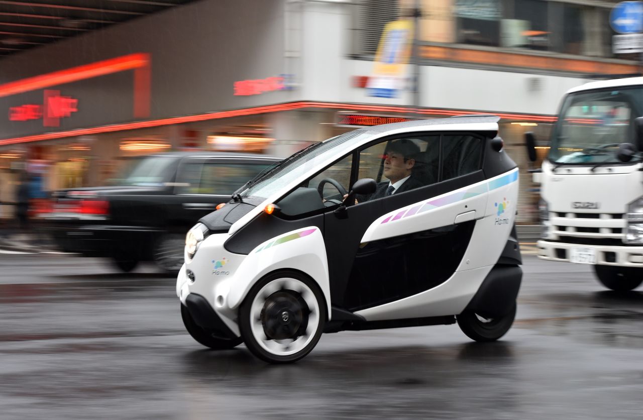 The Toyota i-Road is a three-wheeled, two-seat (driver and passenger sit in tandem) electric "personal mobility vehicle."<br /><br />The little car has a 37-mile range and is able to squeeze into tiny parking slots and weave through traffic, while reducing congestion and carbon emissions. Test drive pilots at the Toyota Tokyo Design Research Laboratory are in the process of trying out the technology.
