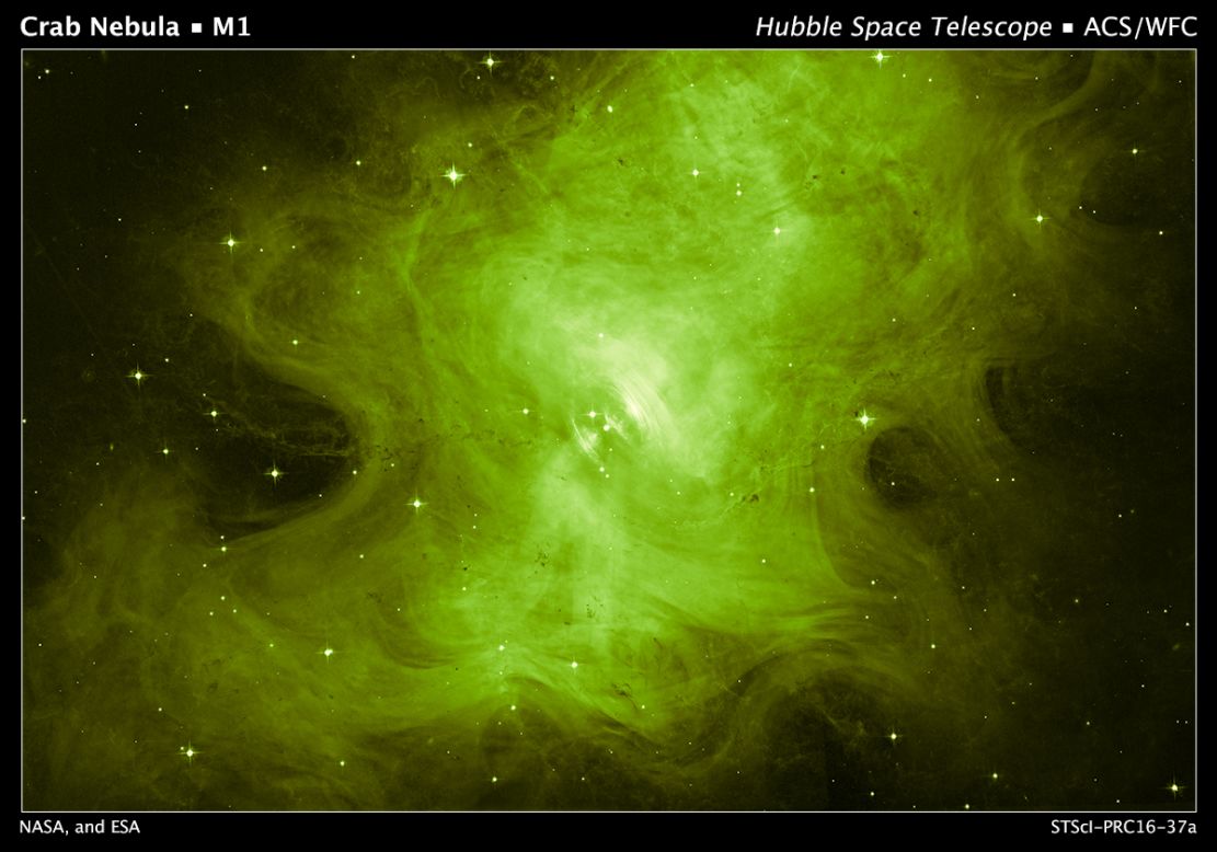 A dead star gives off a greenish glow in this Hubble Space Telescope image of the Crab Nebula, located about 6,500 light years from Earth in the constellation Taurus. NASA released the image for Halloween 2016 and played up the theme in its press release. The agency said the "ghoulish-looking object still has a pulse." At the center of the Crab Nebula is the crushed core, or "heart" of an exploded star. The heart is spinning 30 times per second and producing a magnetic field that generates 1 trillion volts, NASA said.