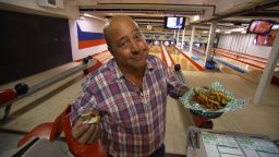 The "Bizarre Foods" host has tasted some interesting culinary treats in his travels to more than 150 countries, but can still appreciate a good burger and fries.