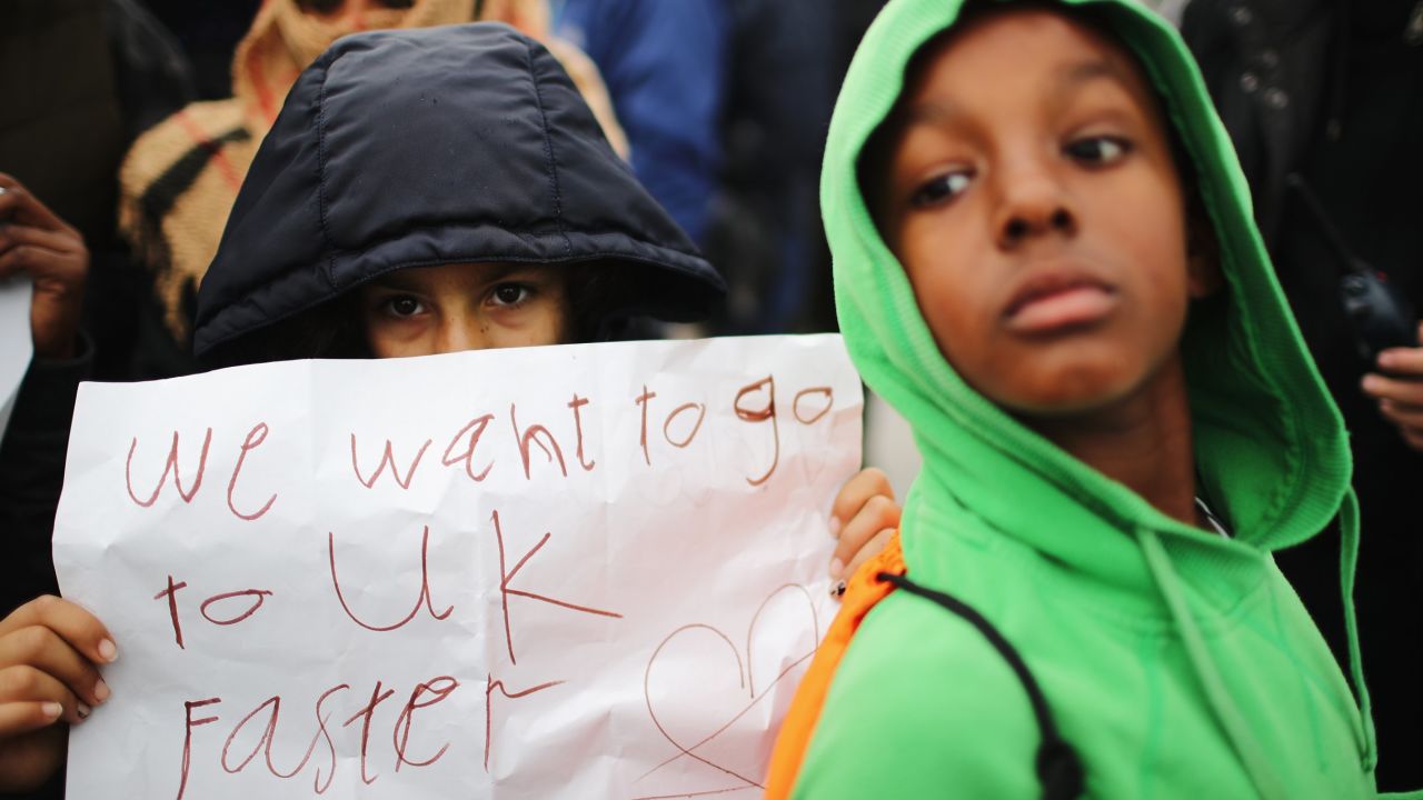 Children protest their case to the UK government at the now-demolished Jungle camp in Calais in October 2016.