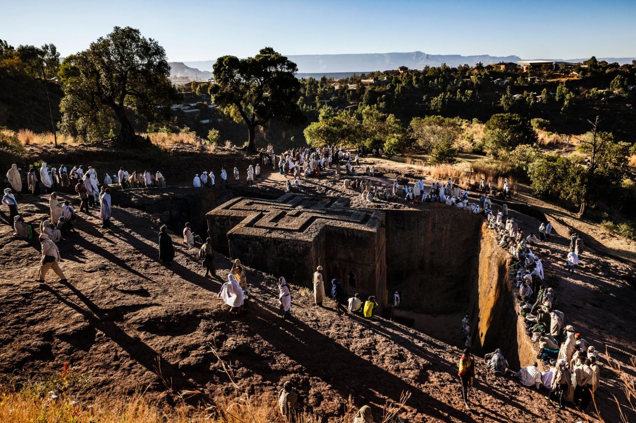 <strong>Words by Tariq Zaidi: </strong>Pilgrims surround the Church of St George in Lalibela, Ethiopia. Shaped like a Greek Orthodox cross, the Church of St George is perhaps the most famous of Lalibela's 11 churches. It was painstakingly excavated out of the rock, some 40 feet down, with hammer and chisel and built after King Lalibela's death by his widow as a memorial. 