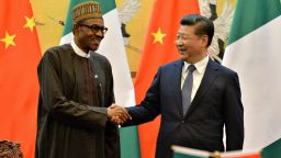 Nigerian President Muhammadu Buhari (L) and Chinese President Xi Jinping shake hands during a signing ceremony at the Great Hall of the People in Beijing on April 12, 2016. Muhammadu Buhari is on a visit to China from April 11 to 15. / AFP / POOL / KENZABURO FUKUHARA (Photo credit should read KENZABURO FUKUHARA/AFP/Getty Images)