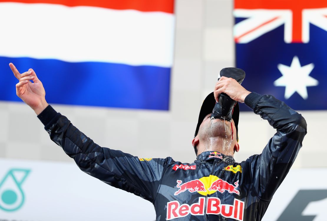 Daniel Ricciardo celebrates with a "shoey" after winning his first race of 2016 in Malaysia