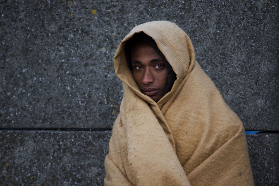 An Eritrean migrant waits to be relocated out of the camp on October 27. French authorities have given thousands of people who were living in the infamous migrant camp two options: seek asylum in France or return to your country of origin.
