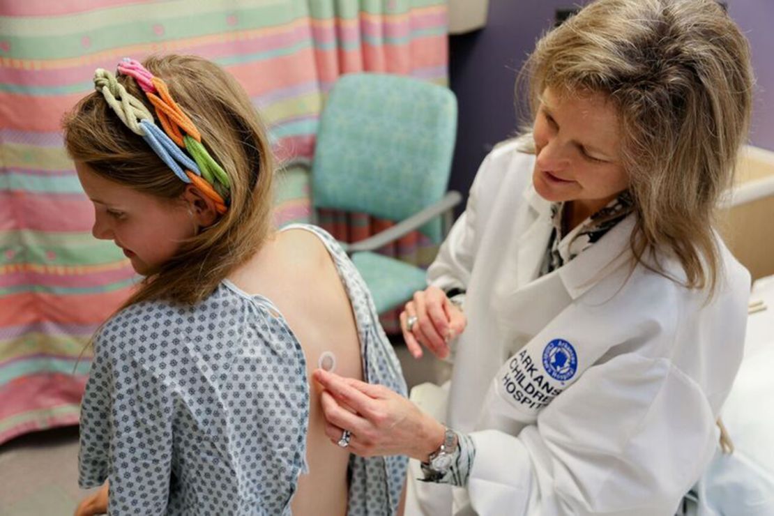 Dr. Stacie Jones applies a peanut patch to a clinical trial participant at Arkansas Children's Hospital.