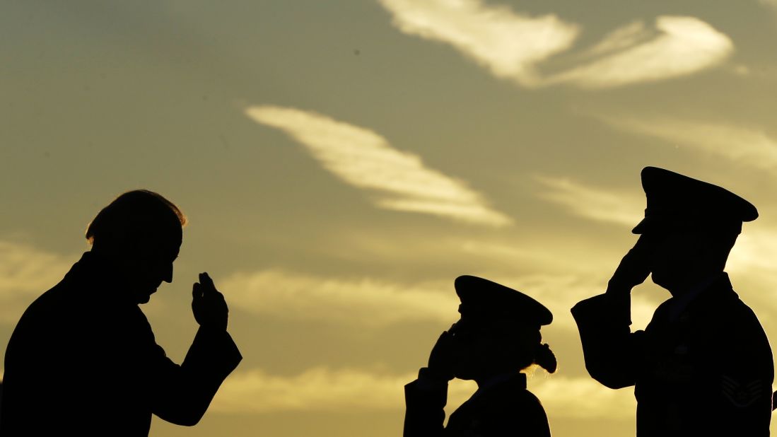 Biden salutes as he boards Air Force One in November 2012.