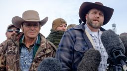 Ammon Bundy(R), leader of a group of armed anti-government protesters speaks to the media as other members look on at the Malheur National Wildlife Refuge near Burns, Oregon January 4, 2016. The FBI on January 4 sought a peaceful end to the occupation by armed anti-government militia members at a US federal wildlife reserve in rural Oregon, as the standoff entered its third day. The loose-knit band of farmers, ranchers and survivalists -- whose action was sparked by the jailing of two ranchers for arson -- said they would not rule out violence if authorities stormed the site, although federal officials said they hope to avoid bloodshed.