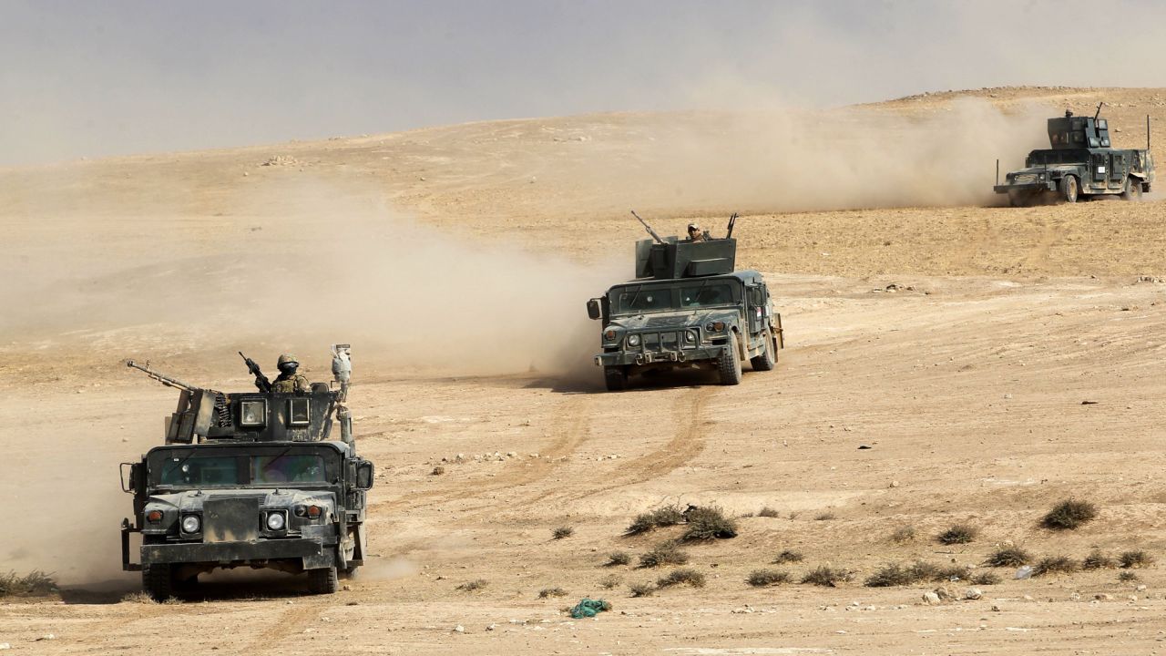 Iraqi forces advance towards the village of Sin al-Dhuban, south of Mosul, on Thursday