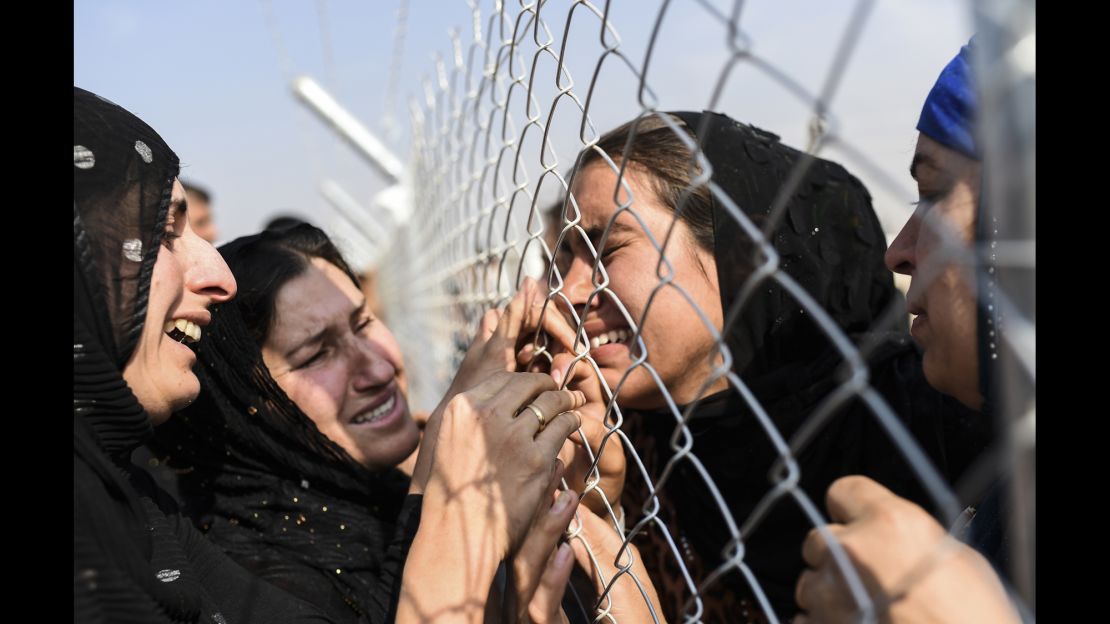Newly displaced Iraqis who fled Mosul are reunited with their relatives who came to Khazir refugee camp two years ago.