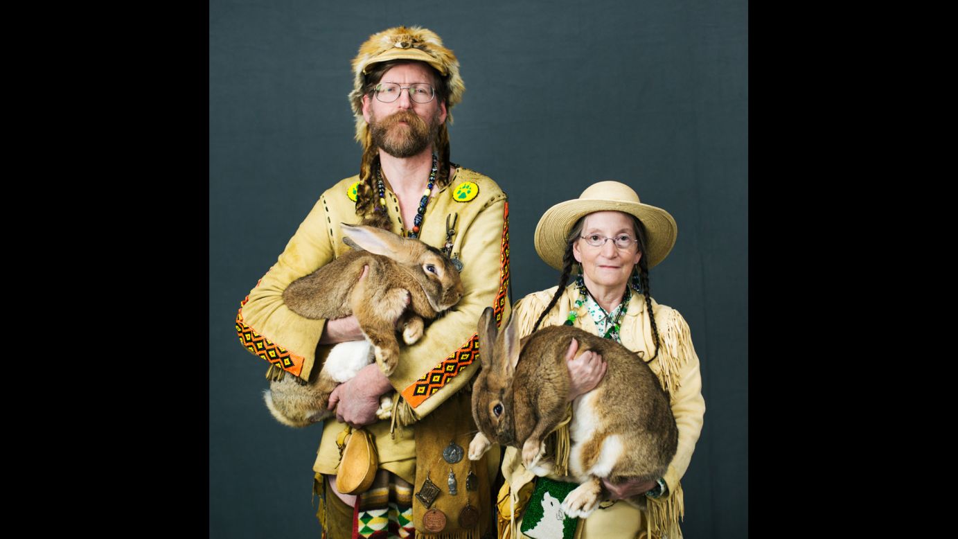 Daniel and Susan Hathaway, of Bandon, Oregon, hold their rabbits Defiance and Enterprise. The rabbits are Flemish Giants, one of the largest rabbit breeds.