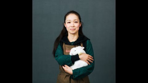 Masako Miyazaki is from Japan. She is holding Sarah, a 4-month-old Holland Lop rabbit. She told Rezvaya she had about 100 rabbits of five different breeds.