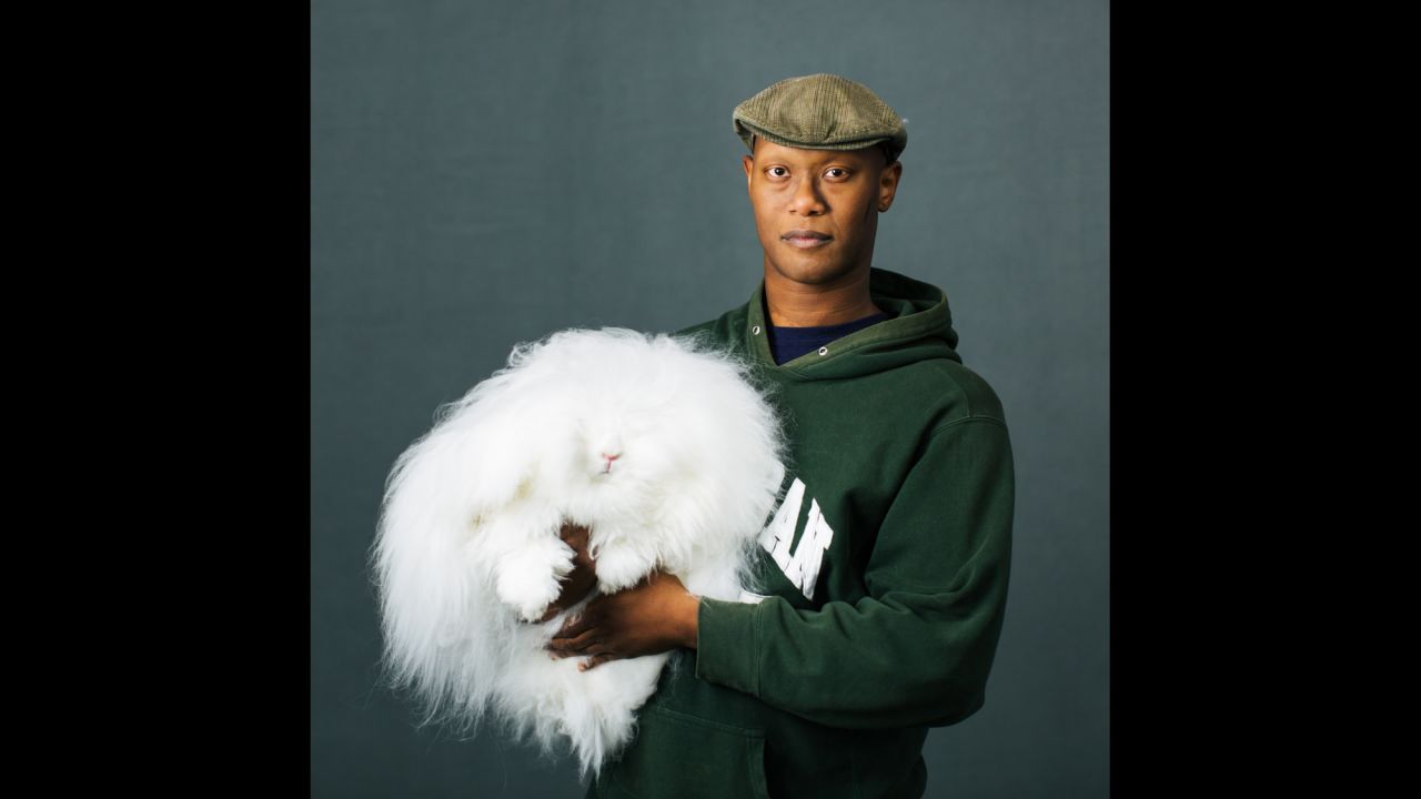 Marcus Rhoden, of Chesaning, Michigan, holds his English Angora named Felicia.