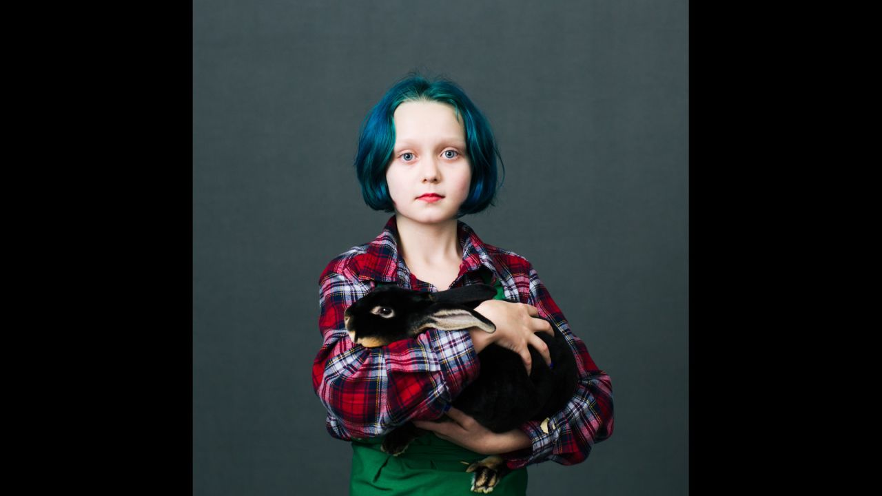 Virginia Anderson, a 10-year-old from Dallas, Oregon, holds Romeo, a Black Otter Rex rabbit.