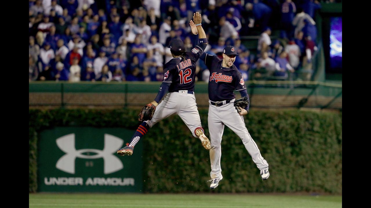 Francisco Lindor and Brandon Guyer of the Indians celebrate after beating the Cubs 1-0 in Game 3.