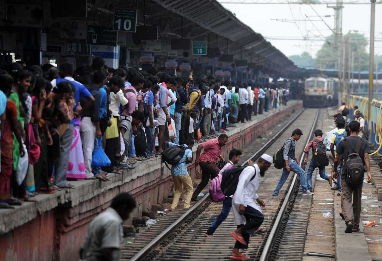 Passengers wait to board a crowded train in Chennai, India, on October 28 on their way to their hometowns ahead of Diwali.