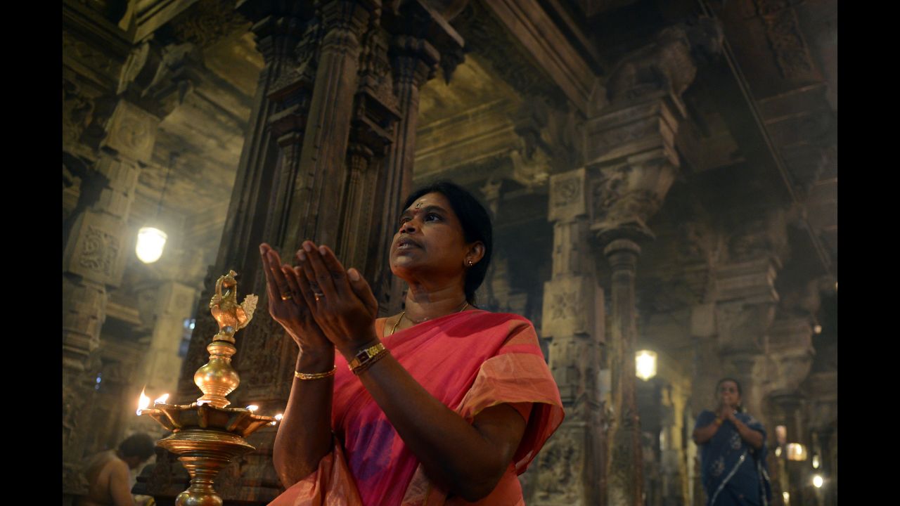 Sri Lankan Hindus pray during Diwali at a temple in Colombo on Saturday, October 29. Hindus around the globe are adorning their houses with lamps, sharing feasts and exchanging gifts to celebrate Diwali, the festival of lights. For Hindus, light symbolizes the triumph of good over darkness, or knowledge over ignorance.