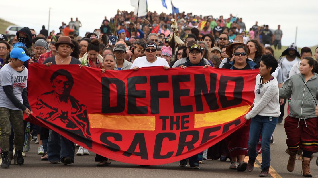 Native Americans march to the site of a sacred burial ground that was disturbed by bulldozers building the Dakota Access Pipeline on September 4, 2016 near Cannon Ball, North Dakota.
