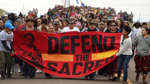 Native Americans march to the site of a sacred burial ground that was disturbed by bulldozers building the Dakota Access Pipeline on September 4, 2016 near Cannon Ball, North Dakota.  
