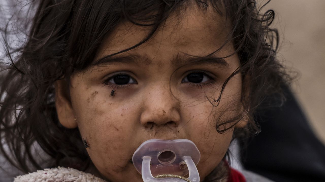 An Iraqi girl, displaced by the battle to retake Mosul from ISIS, is pictured near Qayyarah on Friday.