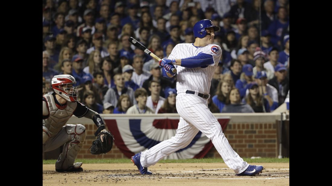 Cubs' Anthony Rizzo hits an RBI single during the first inning of Game 4.