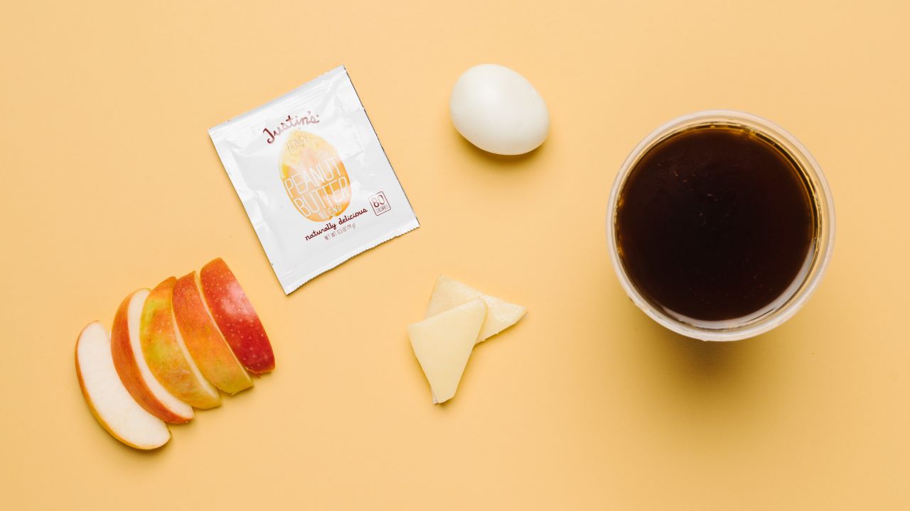 The protein bistro box, with a hard-boiled egg, cheddar cheese, peanut butter and apple slices (minus the muesli bread and grapes) has a carb count of only 11 grams. And café Americano is a low as it goes carb-wise.