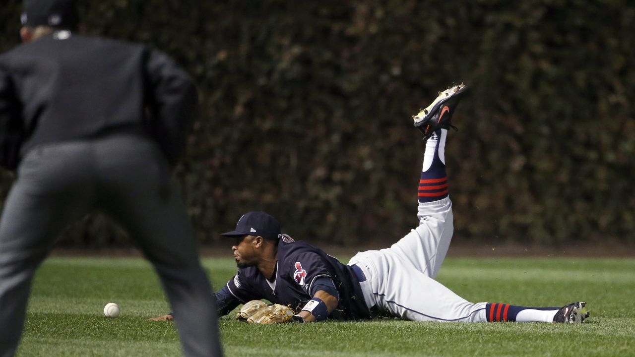 Indians center fielder Rajai Davis can't catch the ball hit by Chicago Cubs' Dexter Fowler during the first inning of Game 4.