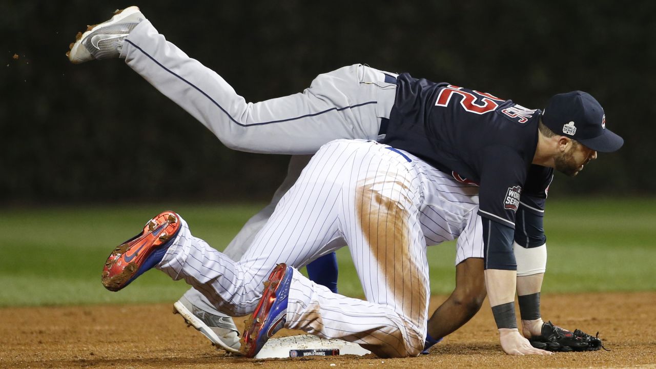 Indians second baseman Jason Kipnis collides with Cubs Jason Heyward as Kipnis turns a double play on a ball hit by the Cubs Javier Baez during the second inning of Game 4.