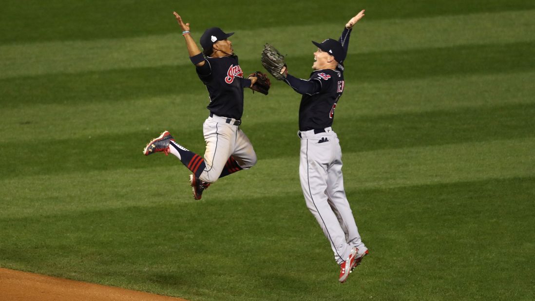 Francisco Lindor, left, and Brandon Guyer, right, of the Cleveland Indians celebrate after beating the Chicago Cubs 7-2 in Game 4 of the 2016 World Series at Wrigley Field on Saturday, October 29, in Chicago.