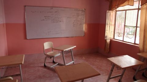 A room in a house in the town of Bazwaya, near Mosul city, was used as an ISIS classroom. The Arabic writing on the whiteboard is a lesson about how to use grenades.