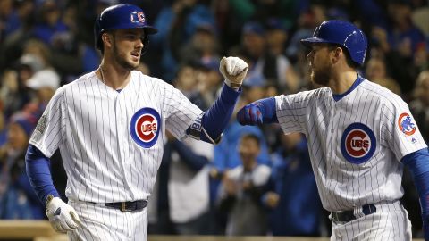 The Cubs' Kris Bryant, left, celebrates with Ben Zobrist after hitting a home run during the fourth inning of Game 5.