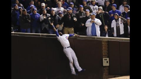 Cubs right fielder Jason Heyward catches a fly ball hit by  Indians' Trevor Bauer during the third inning of Game 5. 