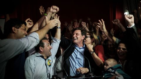 Rio de Janeiro's newly elected mayor, Marcelo Crivella, center, celebrates his win on Sunday.