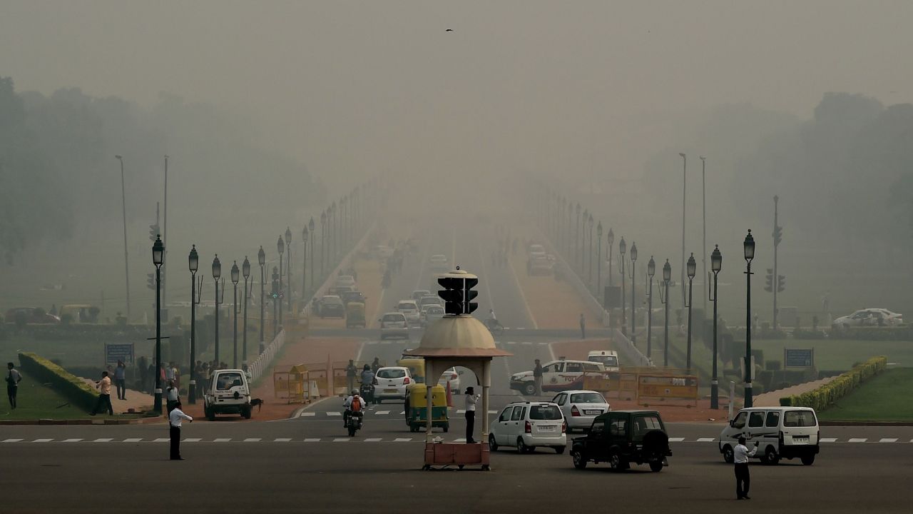 Indian commuters drive through smog in New Delhi a day after the Diwali festival. 