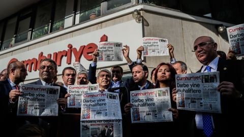 Opposition politicians protest the arrests outside Cumhuriyet's Istanbul offices.