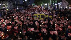 SEOUL, SOUTH KOREA - OCTOBER 29:  Thousands of South Koreans took to the streets in the city center to demand President Park Geun-hye to step down on October 29, 2016 in Seoul, South Korea. The protest stems from allegations that President Park let her friend Choi Soon-Sil interfere in important state affairs. (Photo by Woohae Cho/Getty Images)
