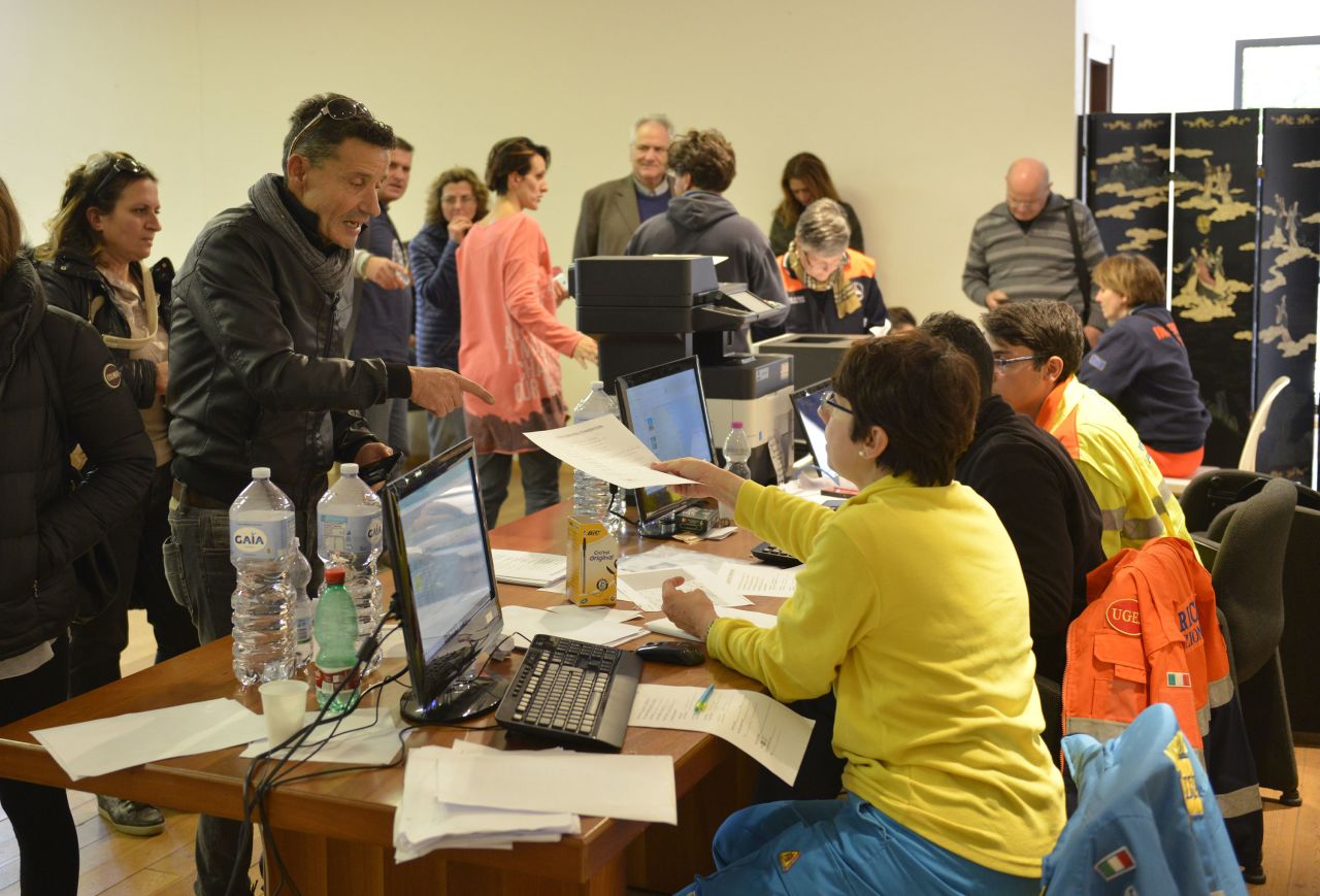 Italian authorities register people for temporary accommodations in the Adriatic coastal town of Porto Sant'Elpidio on October 31, after more than 15,000 were displaced by the latest earthquakes to hit central Italy.