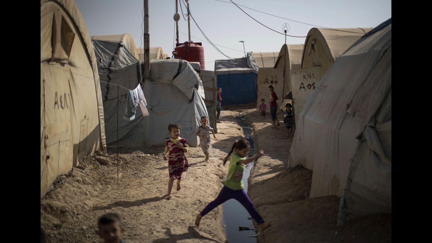 Children play in a camp for internally displaced people near Kirkuk, Iraq, on October 30. More than 600 families from Tel Afar, a town west of Mosul, have been living in the camp since ISIS took control of the area in 2014.