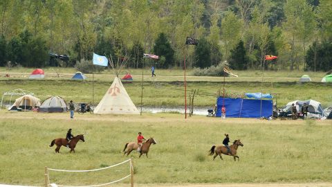 Youths ride horses at an oil pipeline protest encampment near Cannon Ball, North Dakota.