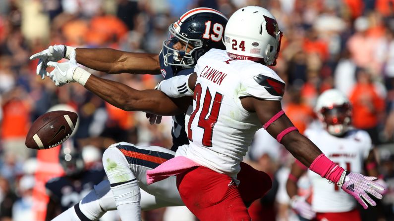 Louisville's Zykiesis Cannon knocks down a pass intended for Virginia's Andre Levrone during a college football game in Charlottesville, Virginia, on Saturday, October 29.