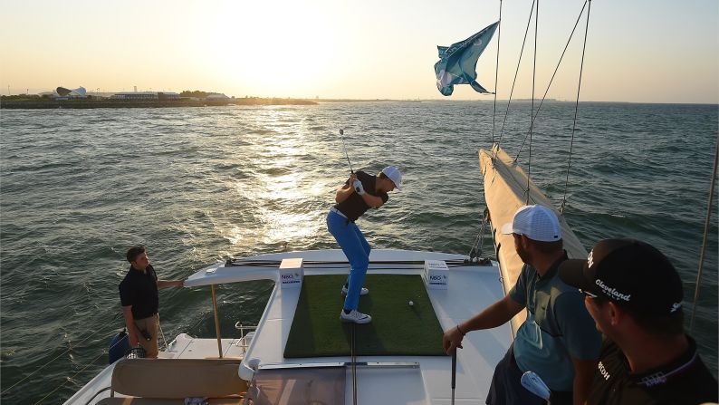 German golfer Alexander Knappe hits a ball off a boat during a promotional event for the Challenge Tour event in Muscat, Oman, on Monday, October 31.